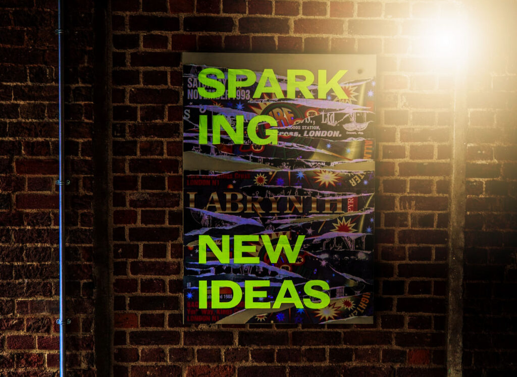 Text in photo of a brick wall says: "Sparking New Ideas"
